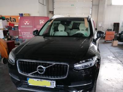 Black Volvo SUV fixed front glass