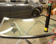 Applying adheisive to glass